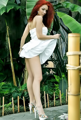 Cheeky redhead Monika E in Tropical botanic garden