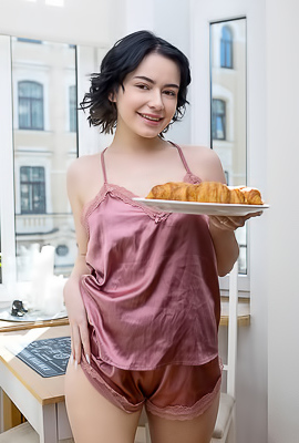 Baiba Rose-colored Silk Camisole That Skims Over Her Lovely Breasts