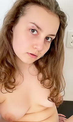 Acabella Reclining, Slowly Swirling A Toys In Tiny Lavender Bikini