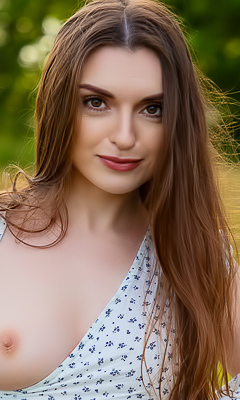 Julia K.s Flirty te glance teases under vast blue sky with towering peaks